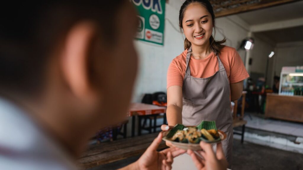Where to eat in Bangkok? Ensure to use both hands while receiving food as an act of respect