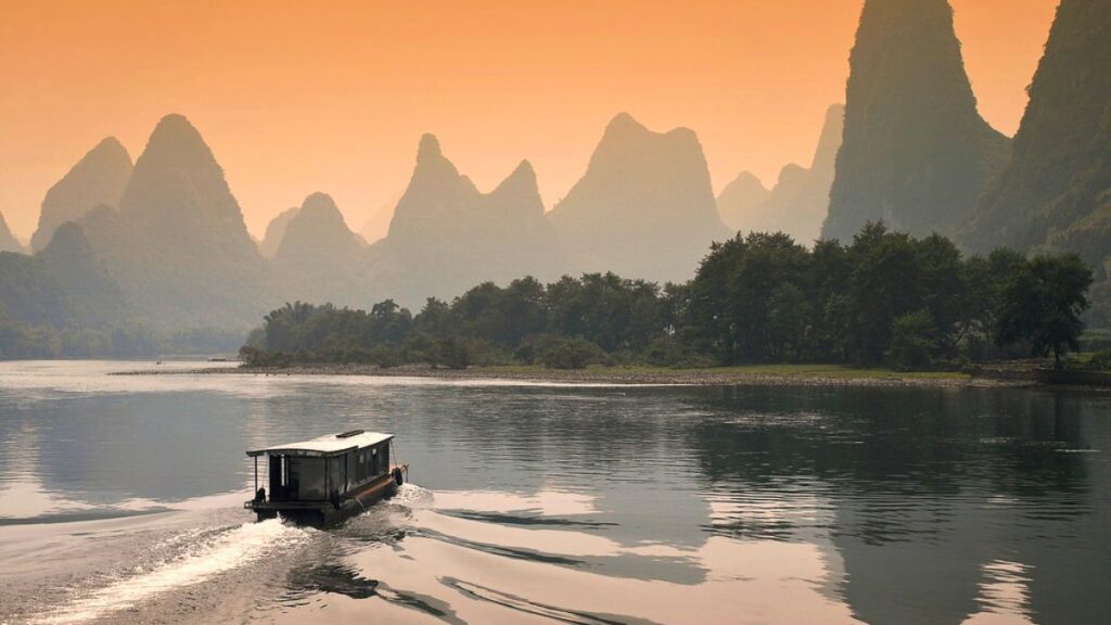 Get on a cruise on Li River in China during a sunset